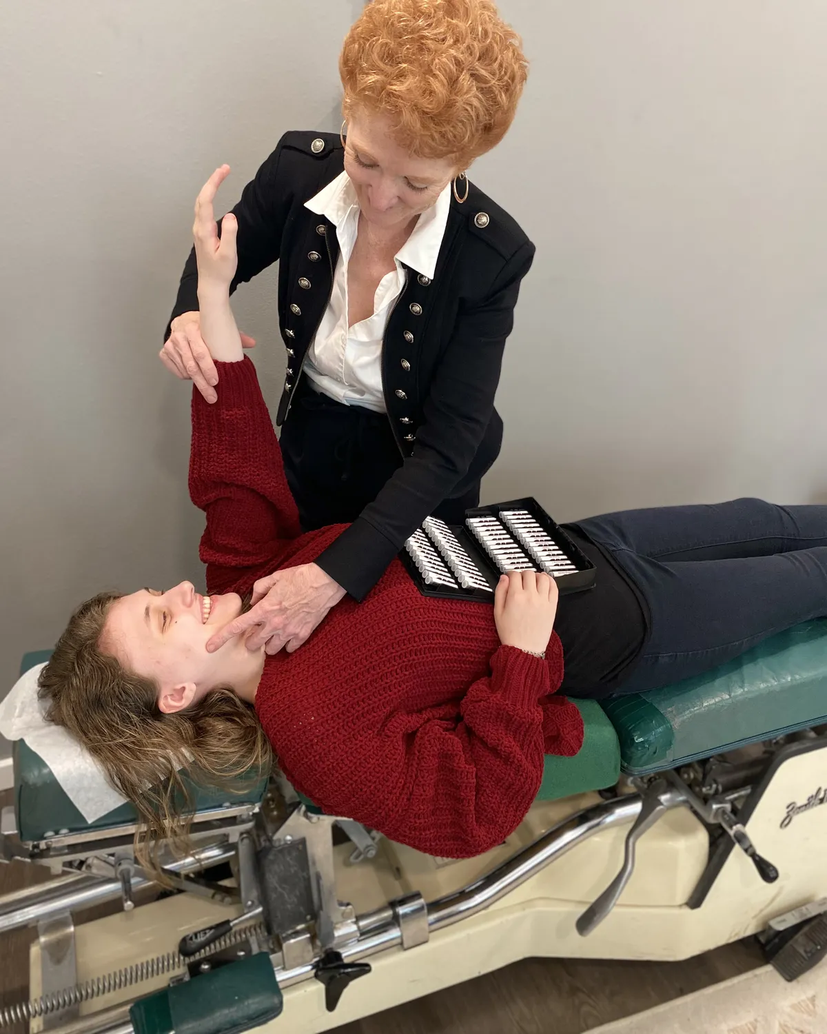 Dr. Mary Schmidt adjusting a patient on a chiropractic table